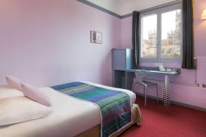 Postel nebo postele na pokoji v ubytování Best Western Hotel Le Guilhem