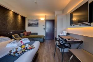 A seating area at Best Western Plus Hotel Farnese
