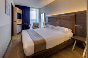 A bed or beds in a room at Best Western Plus Hotel Farnese