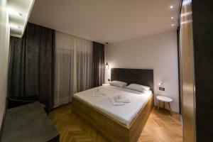 Postel nebo postele na pokoji v ubytování Apartments Agape
