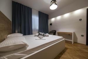 Postel nebo postele na pokoji v ubytování Apartments Agape