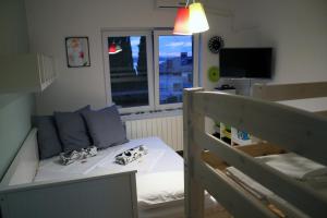 Postel nebo postele na pokoji v ubytování Apartments Agape