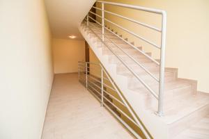 a staircase in a house with a metal railing at Nice place in Rovinj