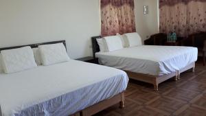 Uma cama ou camas num quarto em Xiao Guilin Homestay