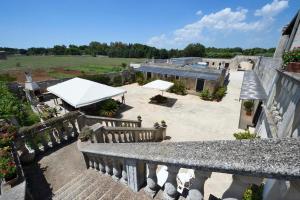 an overhead view of a patio with a white roof at Masseria i Cocci in Maglie