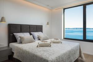 Posteľ alebo postele v izbe v ubytovaní Luxury Villa White Pearl with Pool + 37 fotografií