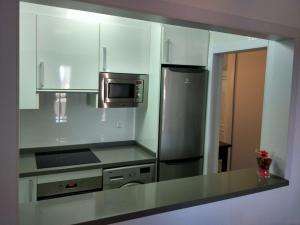 Kuchyňa alebo kuchynka v ubytovaní Precioso Apartamento Frente Al Mar