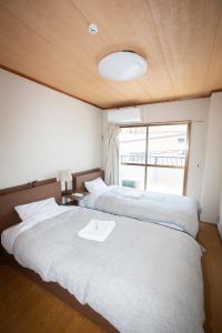 Posteľ alebo postele v izbe v ubytovaní Lazy House