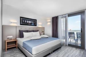 Posteľ alebo postele v izbe v ubytovaní Nymphes Deluxe Accommodation Pefkochori