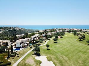 an aerial view of a resort with the ocean at 2 bedroom Villa Destu with private pool and golf views, Aphrodite Hills Resort in Kouklia