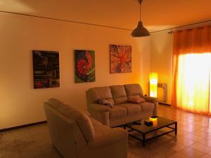 A seating area at Suite Paolo