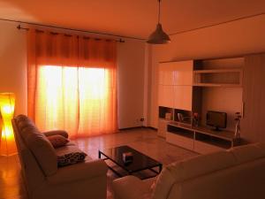 A seating area at Suite Paolo