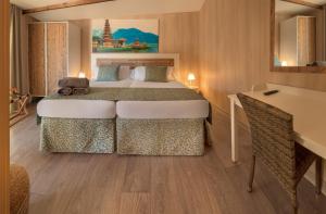 Łóżko lub łóżka w pokoju w obiekcie Magic Natura Resort