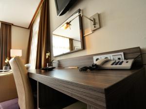 TV a/nebo společenská místnost v ubytování Hotel Faber