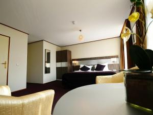 Postel nebo postele na pokoji v ubytování Hotel Faber