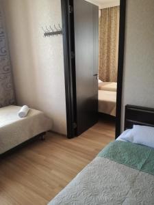 Postelja oz. postelje v sobi nastanitve Guest House Kakheti