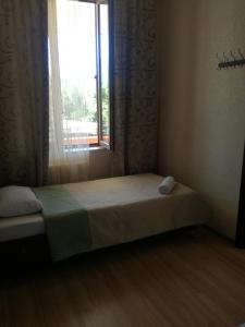 Postelja oz. postelje v sobi nastanitve Guest House Kakheti