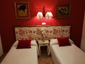 Postel nebo postele na pokoji v ubytování Hostal Maestre