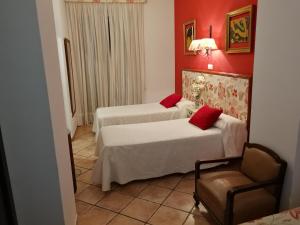 Postel nebo postele na pokoji v ubytování Hostal Maestre
