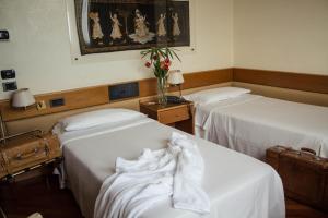 Postel nebo postele na pokoji v ubytování Best Western Hotel Dei Cavalieri