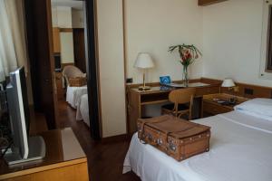 Postel nebo postele na pokoji v ubytování Best Western Hotel Dei Cavalieri