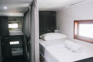 Ένα ή περισσότερα κρεβάτια σε δωμάτιο στο Mellow Hostel