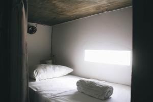 Ένα ή περισσότερα κρεβάτια σε δωμάτιο στο Mellow Hostel