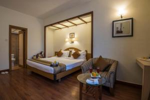 Postel nebo postele na pokoji v ubytování Hotel Park Central Koregaon Park + 36 fotografií