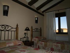 A bed or beds in a room at Apartamentos turísticos La Fuensanta
