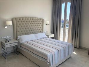 Postel nebo postele na pokoji v ubytování Hotel Atlántico