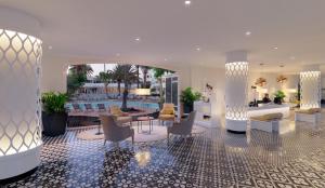 
a living room filled with furniture and a large window at H10 Ocean Dunas - Adults Only in Corralejo
