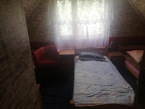 Posteľ alebo postele v izbe v ubytovaní aura