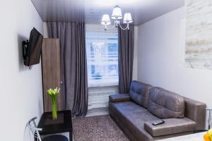 a living room with a couch and a window at Smart apartment проспект Гагарина in Dnipro