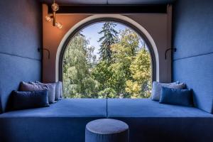Ein Bett oder Betten in einem Zimmer der Unterkunft Gloriette Guesthouse