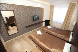Voodi või voodid majutusasutuse Hotel Petrus toas