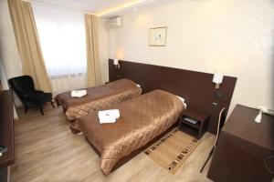 Voodi või voodid majutusasutuse Hotel Petrus toas