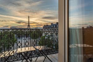 a view of the eiffel tower from a balcony at Hôtel La Comtesse in Paris