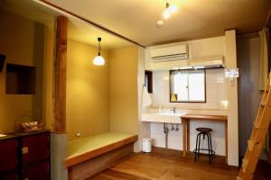 Kuchyň nebo kuchyňský kout v ubytování Yuzan Guesthouse + 37 fotografií