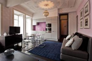 a living room with a couch and a table at Apartments of the Marques in Lisbon