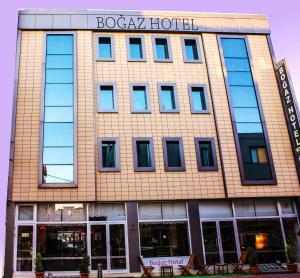 a building with a sign on the front of it at Canakkale Bogaz Hotel in Çanakkale