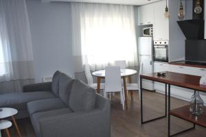 a living room with a couch and a table at Apt 16-Tirana Very Central Apartment in Tirana