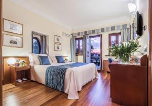 Postel nebo postele na pokoji v ubytování Hotel Ponte Sisto
