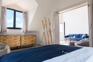 Łóżko lub łóżka w pokoju w obiekcie Apartamenty Port Ustka