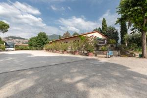 a building with potted plants in front of it at Hotel Villa Elda in Assisi