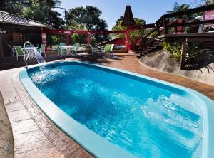 Swimmingpoolen hos eller tæt på Pousada Vila Taquaras