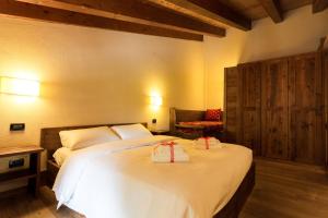 Posteľ alebo postele v izbe v ubytovaní Le Petit Coeur Residence De Montagne