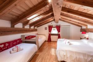 Posteľ alebo postele v izbe v ubytovaní Le Petit Coeur Residence De Montagne