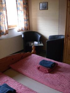 A bed or beds in a room at Gruppen und Familienhof FALKENSTEIN