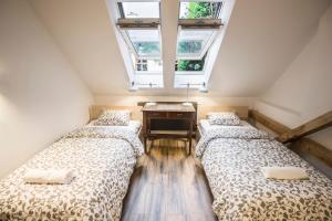 Posteľ alebo postele v izbe v ubytovaní Sewa Apartments