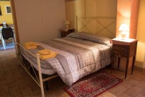 Voodi või voodid majutusasutuse Lo Sfizio B&B toas